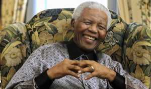 Former president of South Africa Mandela chats with Britain's Prime Minister Brown in London